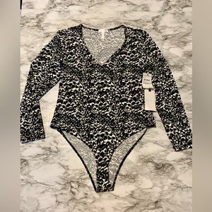 New with Tags. Black and white Bodysuit XL